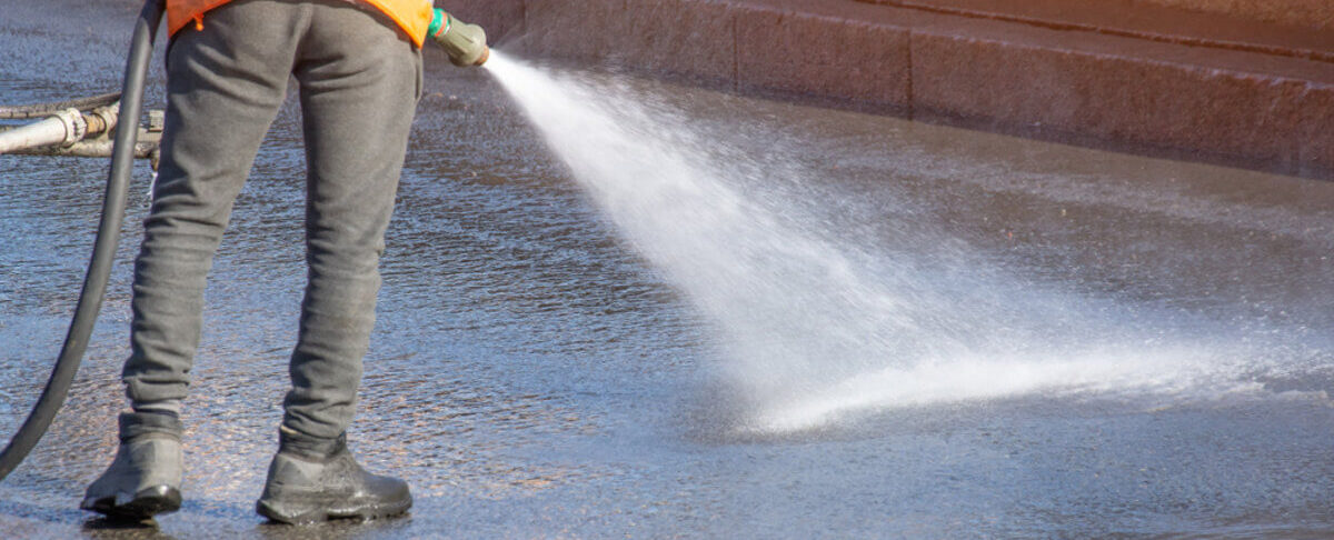 cleaning an asphalt driveway